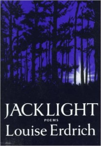 The cover of Louise Erdrich's Jacklight, which features tall trees against an evening sky